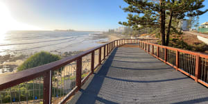After five years the beach walkway opens around Alexandra Headlands from Mooloolaba consigning memories of the beachside caravan park to history.