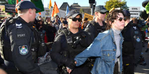 Protesters vow more disruption to come as more than 70 arrested in Brisbane