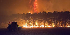 Volunteer firefighter Nikki Woods captured how tall the flames reached on Tuesday morning.