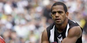 Davis in action for the Pies in the 2011 grand final.