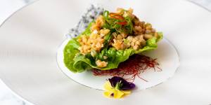 Sang choy bao – a single leaf of cos lettuce topped with diced southern rock lobster.