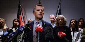 Jason Clare alongside state education ministers during a press conference on Friday.