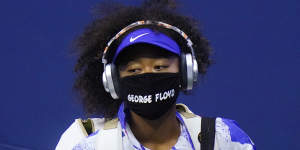 Naomi Osaka wears a COVID-19 mask featuring the name George Floyd,while arriving on court during the 2020 Us Open.