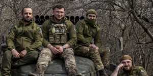 Ukrainian servicemen sit on their vehicle,on the frontline in Donetsk region on Saturday.