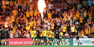 Red Bled redemption:The Wallabies celebrate in Brisbane.