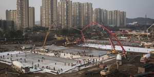 Hundreds of construction workers and heavy machinery build new hospitals to tackle the coronavirus on January 28,2020 in Wuhan,China.