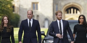 (From left),Princess Catherine,Prince William,Prince Harry and Meghan walk to meet the public after the death of Queen Elizabeth in September 2022.