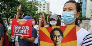Anti-coup protesters march along a street in Yangon,Myanmar,in April.