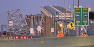 Parts of the Francis Scott Key Bridge remain after a container ship collided with a support.