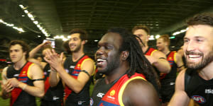 Bomber hero:Essendon’s Anthony McDonald-Tipungwuti is the centre of attention.