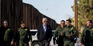 President Joe Biden talks with Border Patrol agents as they walk along a stretch of the US-Mexico border in El Paso,Texas,in 2023.