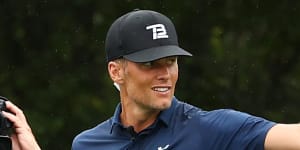Brady stuns but Woods,Manning too good in charity match