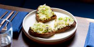 The go-to dish:Herring toast features chopped herring,eggs,pickled cucumbers,green apples and mustard.