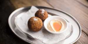 Arancini,deep-fried risotto balls loaded with parsley and lemon zest.