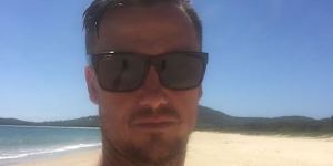 Former surfing champion Chris Davidson died after an alleged one-punch assault outside a pub in NSW mid-north coast.