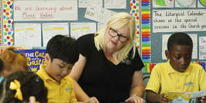 Literacy leader Kirrily Wallace with students at Bethany Catholic Primary School.