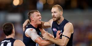 Harry McKay and Patrick Cripps (left) celebrate a goal.