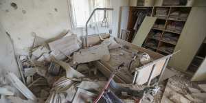 A house is heavily damaged after it was hit by a missile fired from the Gaza Strip.