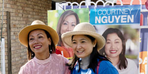 Independent candidate Dai Le (left),campaigning in St Johns Park. 