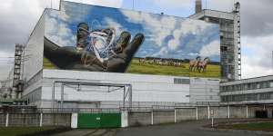 A huge mural decorates the wall at the entrance to the Chernobyl nuclear power plant. Ukraine uses the deserted exclusion zone around the plant to store its nuclear waste for the next 100 years. 