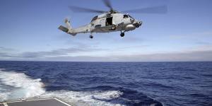 An Australian Navy Seahawk helicopter had a near miss with a Chinese fighter jet.