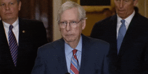 Mitch McConnell freezes before the cameras.