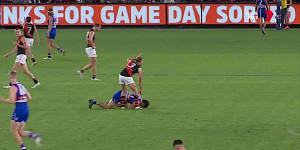 Tom Liberatore’s opponent signals for assistance.