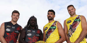Zach Merrett and Anthony McDonald-Tipungwuti of the Bombers and Marlion Pickett and Toby Nankervis of the Tigers ahead of the Dreamtime at the ’G Game.