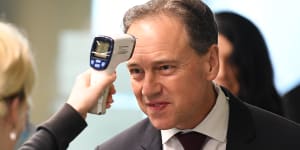 Federal Health Minister Greg Hunt,having his temperature checked before touring the Royal Melbourne Hospital,has delayed the vaping nicotine ban.