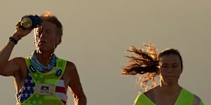Westergaard,left,cools of with water with pacing help from daughter Madison Westergaard as the sun rises during the Badwater 135 Ultramarathon on July 8.