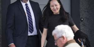 Meng Wanzhou,back right,is out on bail and remains under partial house arrest in Canada.