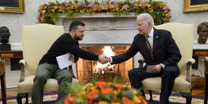 US President Joe Biden shakes hands with Ukrainian President Volodymyr Zelensky in the Oval Office.