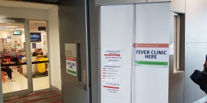 Signage points to the clinic set up at the Gold Coast University Hospital as Queensland ramps up efforts to counter coronavirus.