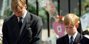 Prince William and Prince Harry bow their heads as their mother’s coffin is taken out of Westminster Abbey after Princess Diana’s funeral in 1997.