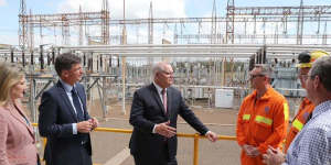 Prime Minister Scott Morrison (centre) visits the Tomago aluminium smelter near Newcastle with Angus Taylor,the Minister for Energy and Emissions Reduction (second from left),in September.