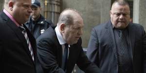 Harvey Weinstein,centre,arrives for a court hearing on Wednesday in New York.