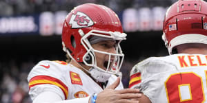 Patrick Mahomes and Travis Kelce celebrate a touchdown during the AFC championship game.