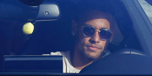 Brazil striker Neymar arrives at Barcelona's training grounds on Wednesday.