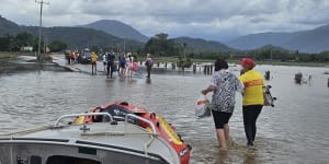Soldiers assist personnel from Queensland Police and Surf Life Saving Queensland with recovery operations in Cairns on December 18.