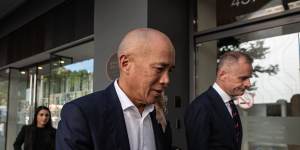 Neurosurgeon Charlie Teo departs a Health Care Complaints Commission Professional Standards Committee inquiry in February 2023.