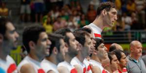 Head and shoulders above his opponents ... but there’s no bed in Paris for volleyball star