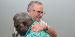 Solomon Islands Prime Minister Manasseh Sogavare greets Anthony Albanese at the Pacific Islands Forum in Fiji.