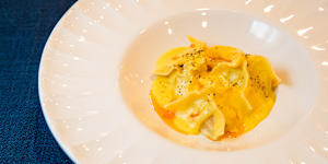 Dumplings in creamy corn sauce. 