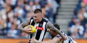 Jordan De Goey,who starred for the Magpies,is tackled by Patrick Dangerfield.