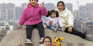 Xu Zhenzhen with her girls:“Taking care of children every day is too boring,” she says. “I hope my daughters can pursue their own dreams.”