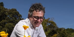Curator-manager of the Royal Botanic Gardens Sydney,David Laughlin among the California poppies in the wild flower meadow. 