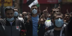 Palestinian Hamas supporters chant anti Israel slogans during a protest in solidarity with Muslim worshippers in Jerusalem.