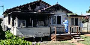 Police at the scene of the fatal house fire in Toowoomba.