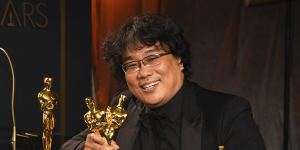 Bong Joon-ho holds the Oscars for best original screenplay,best international feature film,best directing and best picture.