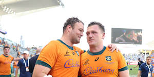 Wallabies captain Harry Wilson and tryscoring hero Angus Bell celebrate after the victory over Argentina.